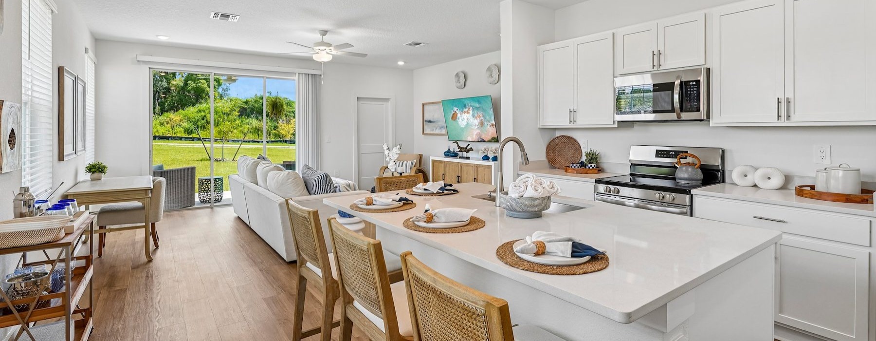 a kitchen with white cabinets