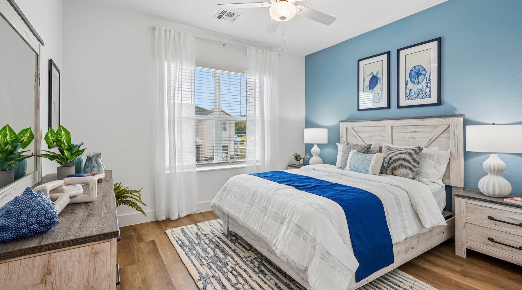 a bedroom with a bed and two nightstands