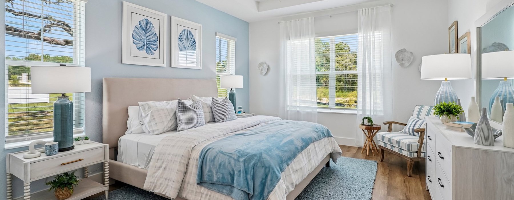 a bedroom with a bed and a fan